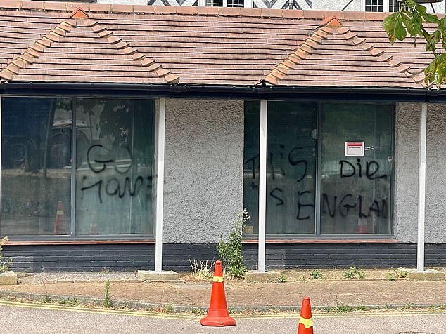 A migrant hotel where a protest turned violent has been graffitied with slogans 'go home', 'die' and 'this is England'