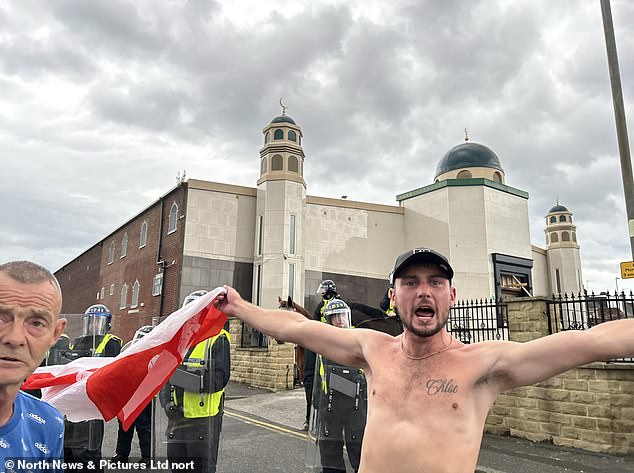 Ministers are under pressure to ditch 'two-tier' plans for a new definition of Islamophobia after an official report raised concerns about free speech. Pictured: Rioters gathered at Millfield Mosque in Sunderland after the Southport stabbings last July