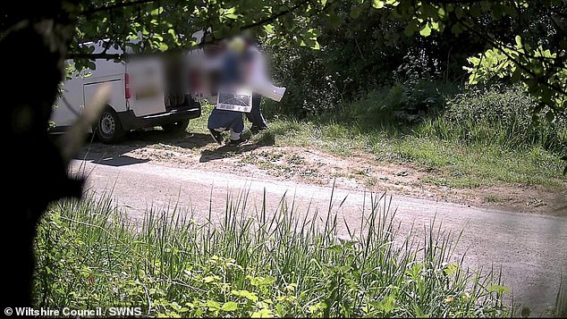 This was the moment a couple dumped a van-load of rubbish at the side of a road in rural Wiltshire - unaware they had been captured on covert CCTV