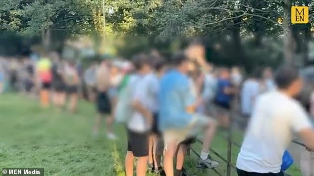 Hoards of Oasis fans were seen climbing over fences and trying to enter the gig