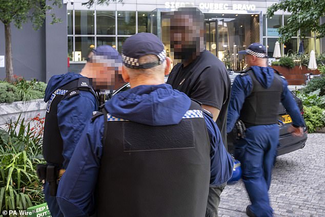 Dramatic bodycam footage shows armed officers barge into a property in the Isle of Dogs, east London on June 26 as they arrest a suspected county lines criminal