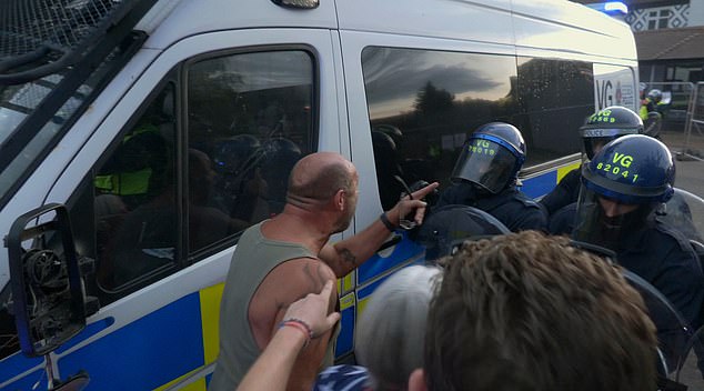 Riot police smashed a shield into a protester's face and knocked his teeth out in a heated clash outside an Epping migrant hotel