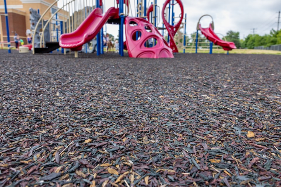 Recycled rubber playground surface.