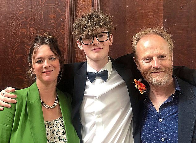 Katy, 51, and Louis,58, with their son Fergus