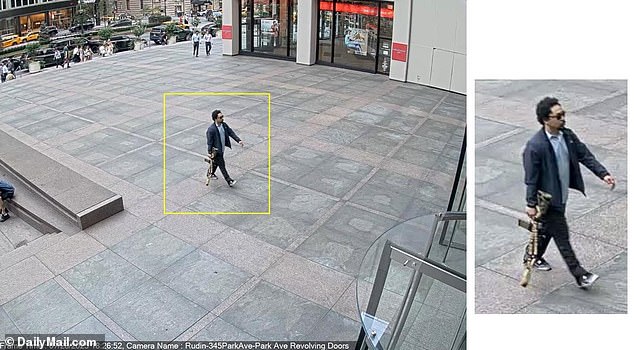 Photos posted online showed the gunman wearing a sport coat and button-down shirt while carrying the large rifle near a midtown Manhattan office building