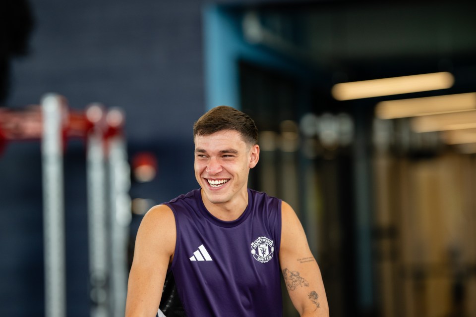 Manuel Ugarte of Manchester United smiling during a training session.