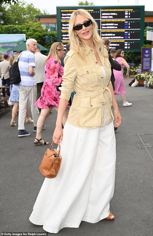 New mum Poppy Delevingne was seen for the first time since giving birth on Sunday as she headed to Wimbledon day seven with her father Charles