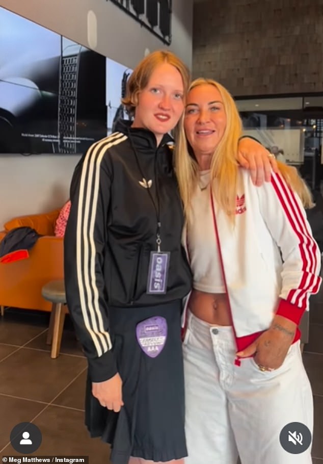 Meg kept it casual for the gig as she posed in a white and red striped Adidas bomber jacket, which she paired with a white t-shirt and matching jeans, as well as an array of gold jewellery (Meg pictured with one of Anais' friends)