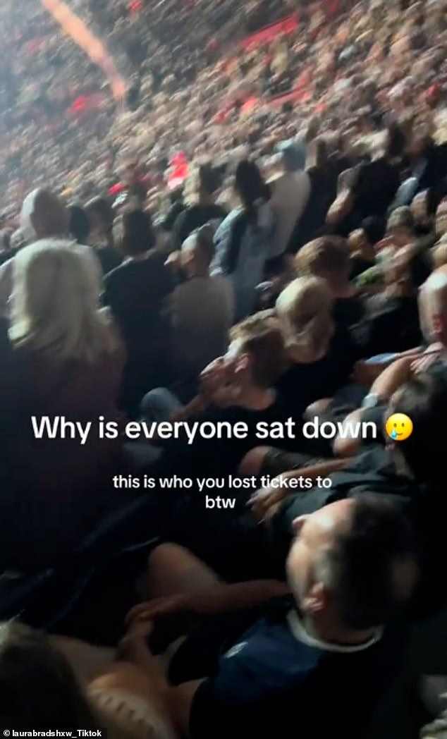 One clip shared by fan Laura Bradshaw showed a host of people blankly staring ahead and sitting down as the duo sang their hit Cast No Shadow on Saturday night