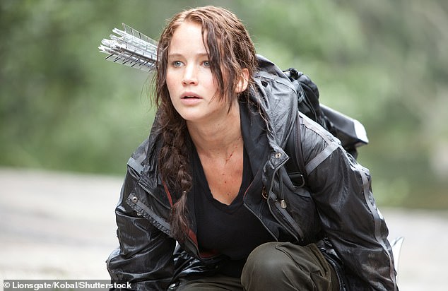 The brunette beauty lamented her love life and compared the show to the dystopian film series that sees teens battle to the death as 'you never know when you¿re going to be dumped' [Jennifer Lawrence pictured in The Hunger Games]
