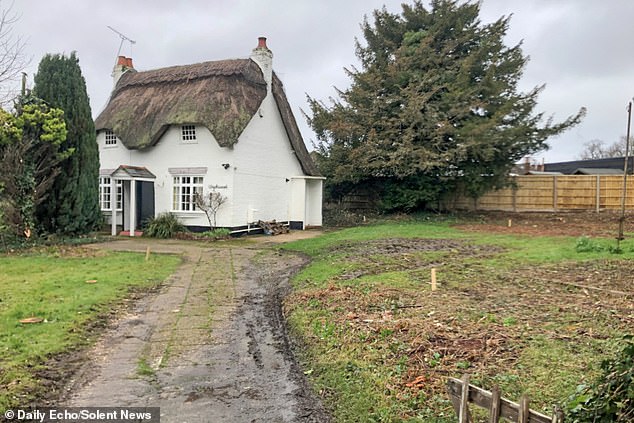 The new owner of a 300-year-old cottage (pictured) who sparked outrage by demolishing the historic local landmark has broken her silence