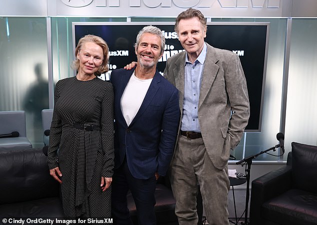 Pamela Anderson (L) and her Naked Gun leading man Liam Neeson (R) brought their undeniable chemistry to SiriusXM Studios in Manhattan on Wednesday where host Andy Cohen (M) shared rare insight into their budding romance