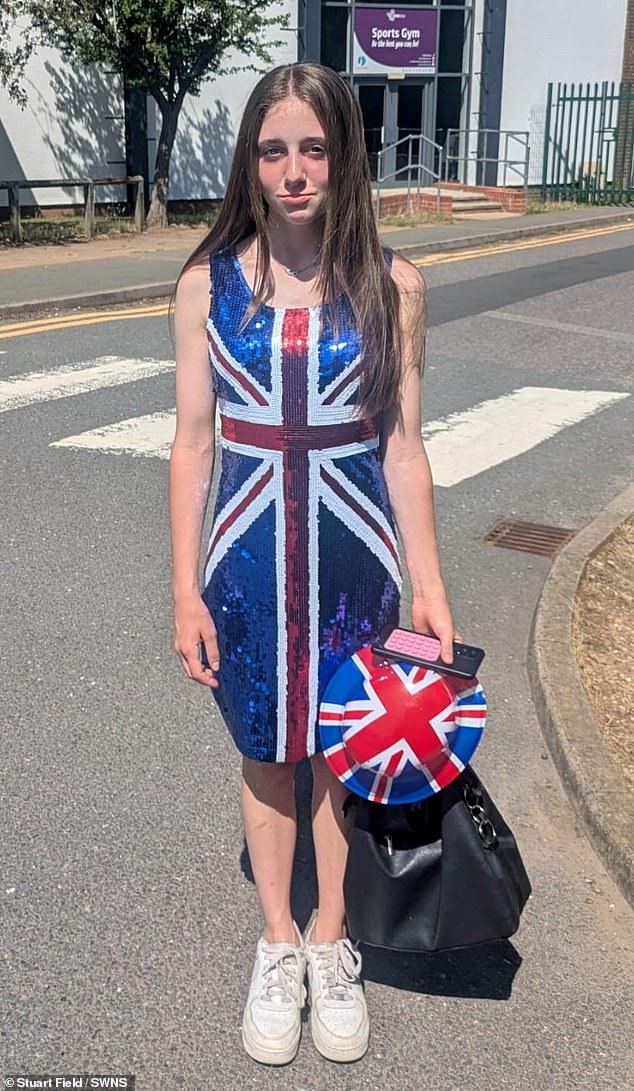 Courtney Wright poses for a photo showing her costume after being made to leave school on culture day