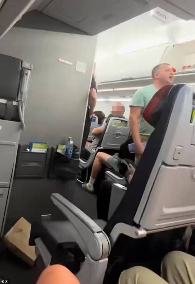 A crazed passenger aboard an American Airlines flight unleashed a fiery, expletive-laden 12-minute tirade, leaving fellow travelers stunned