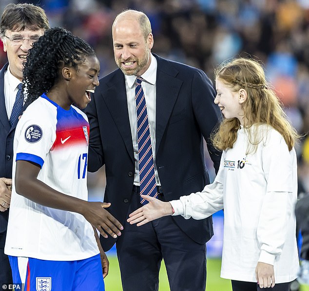 The young girl was later revealed as 12-year-old Greta from Switzerland, who has a genetic form of epilepsy. Pictured congratulating the tournament's best young player England's Michelle Agyemang