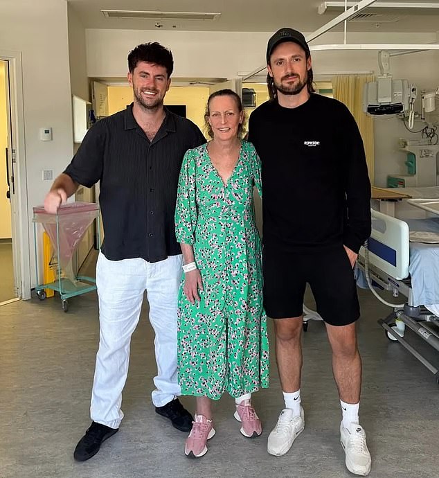 In a post uploaded to Instagram , Ms Shalloe could be seen wearing a green dress standing in the middle of two of her children, Spencer and Bertie, in a hospital ward