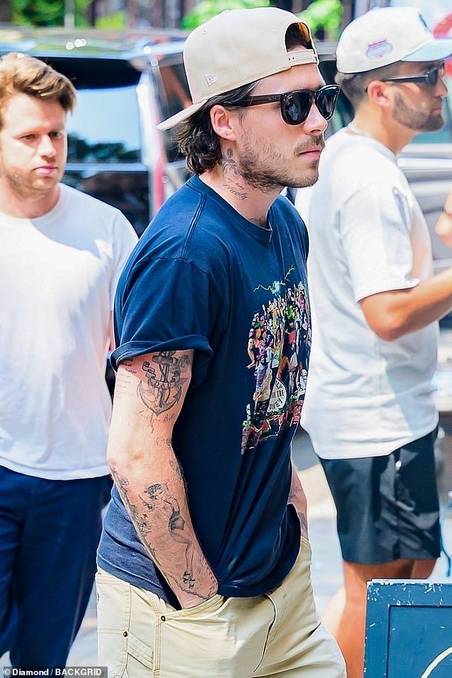 Meanwhile, glum looking Brooklyn was spotted with his wife Nicola Peltz and her mother Claudia on an outing in New York after spending time on a superyacht in St Tropez last week