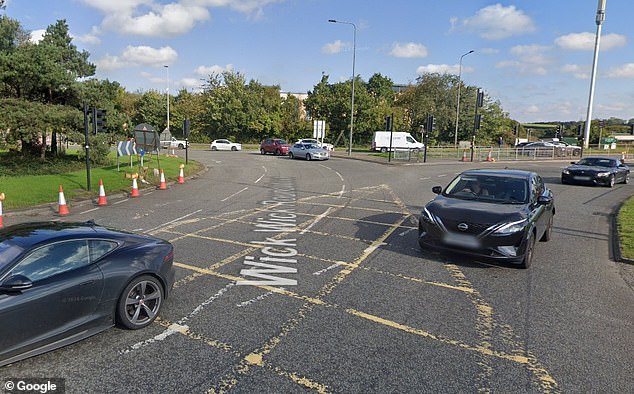 The unmarked police car collided with a 19-year-old woman at a roundabout (pictured), where the A4174 joins Badminton Road in Emersons Green