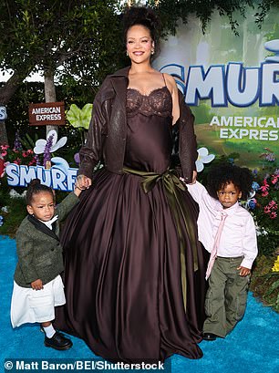 The ensemble contained a drop-down waist as well as lace details at the top and material that flowed down underneath a green bow