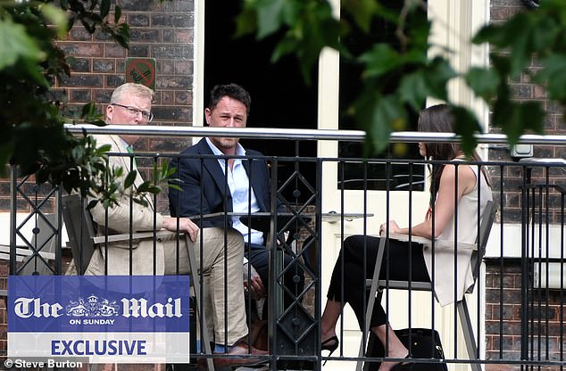 King Charles and Prince Harry's senior aides held a secret peace summit in London. Pictured: The head of communications for Royal Family Tobyn Andreae (left) and Meredith Maines head of communications for The Sussexes (right) with Liam Maguire, who runs the Sussexes' PR team in the UK (centre)