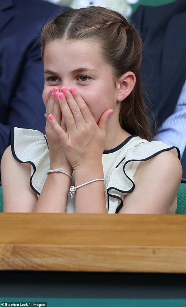 Princess Charlotte was seen looking animated during the Wimbledon men's final on Sunday, showing off her funky pink nail varnish