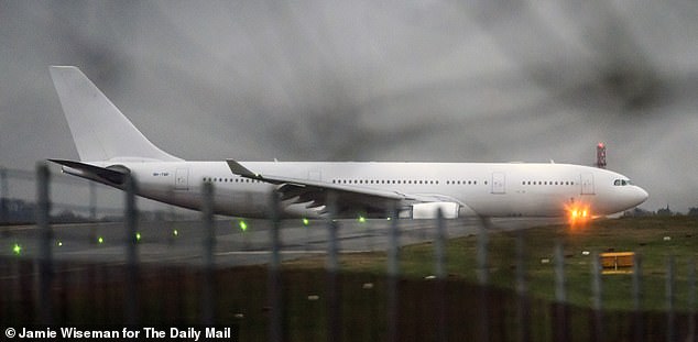 A government chartered plane carrying Afghan refugees arrives at Stansted Airport