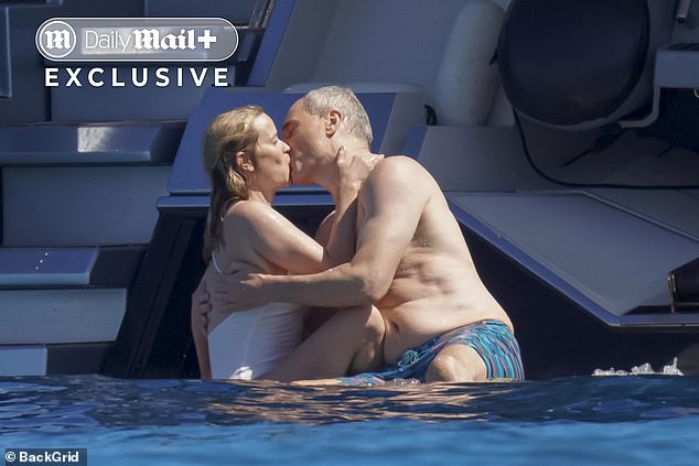 Reese Witherspoon looked totally loved-up with boyfriend Oliver Haarmann as the pair passionately kissed during a holiday in Saint-Tropez on Saturday
