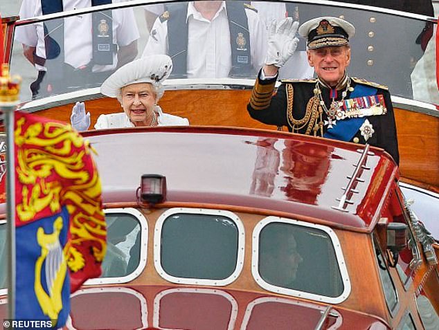 Queen Elizabeth II and Prince Philip wave to onlookers during a pageant in celebration of the Queen's Diamond Jubilee along the River Thames in June 2012. Philip ended up in hospital after he refused to sit down during Queen Elizabeth II's Diamond Jubilee celebrations due to fears he would look like 'Mr Beckham'
