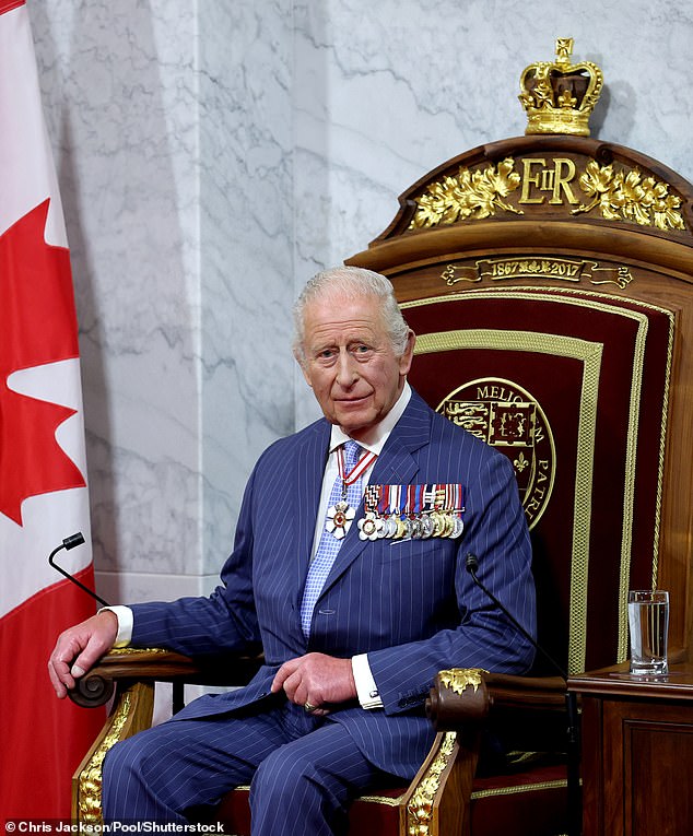 King Charles sits on the throne in the Senate Chamber for the State Opening of Parliament during an official visit to Canada on May 27, 2025 in Ottawa, Ontario