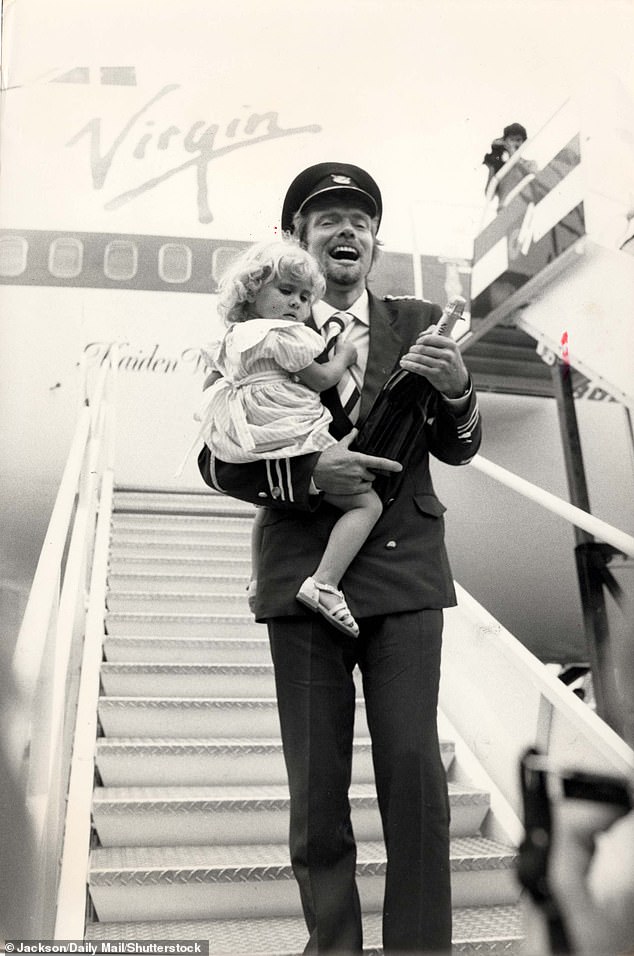 Holly has previously described how as a child she 'dressed like a boy, stood up to pee, and even gave myself different male names' (pictured with her father in 1984)
