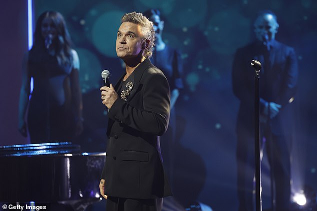 Robbie Williams, 51, has shared a heartbreaking update on his mother Janet's current health amid her battle with dementia (pictured in February)