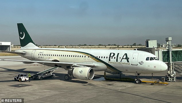 Pakistan International Airlines (PIA) passenger plane sits on the runway in 2023. The carrier has been banned from flying direct to the UK following safety concerns after a crash in 2020