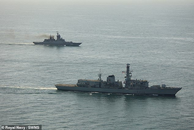 Wildcat aircraft from 815 Naval Air Squadron have also been tracking Russian vessels in UK waters. Pictured: HMS Iron Duke shadows RFN Boikiy