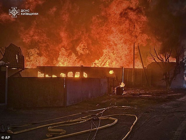 This photo provided by the Ukrainian Emergency Service shows a fire following a Russian attack in Kyiv region, Ukraine, Wednesday, July 9, 2025