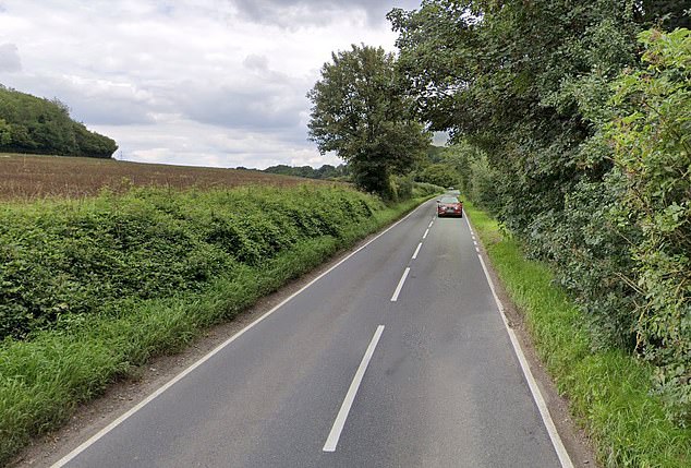 A 14-year-old boy has been killed after he was tragically knocked down by a car towing a trailer. Pictured: General view of Lovedean Lane in Hampshire