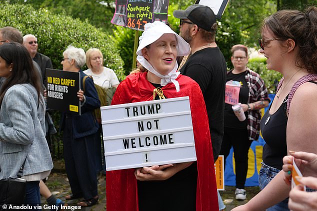 Demonstrators gathered outside the US Consulate to voice opposition to President Donald Trump ahead of his visit to Edinburgh, Scotland on Saturday