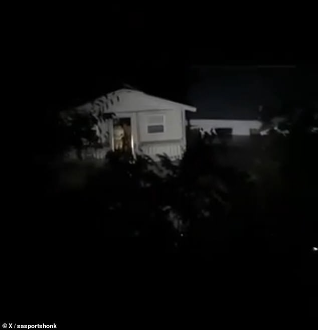 Piercing yellow flashes of a flashlight were seen peaking out the door as a cabin full of people was it was swept downriver in Hill County , Texas, in the middle of the night. Screams from inside the home could be heard as the structure rapidly followed the current of the river