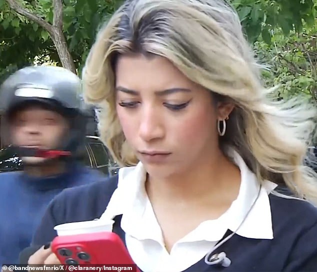 Band television reporter Clara Nery was typing a message on her cell phone when a mugger (left) attempted to steal the device from her hand