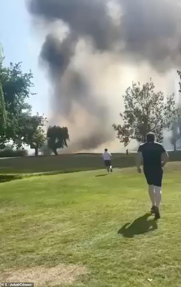 This is the terrifying moment passerbys run towards the plane crash at Southend Airport trying to see if they can help