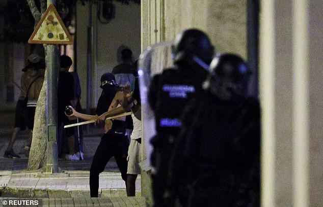 Young men who descended on the town threw objects at police amid the unrest on Saturday night