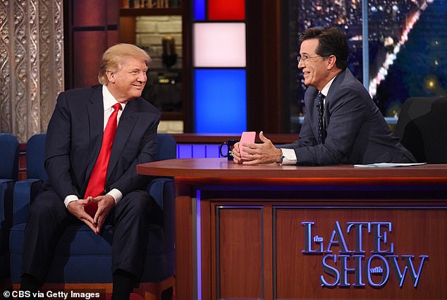 Colbert slammed his CBS show's parent corporation, Paramount, for settling a defamation lawsuit with Donald Trump, calling it a 'big, fat, bribe (Pictured: Trump on The Late Show as a guest on September 22, 2015)