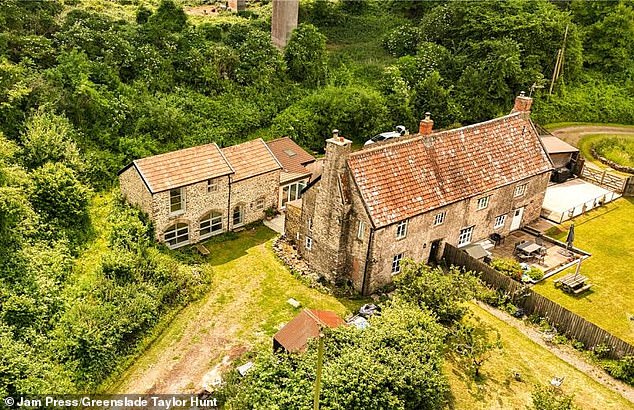 The Grade II-listed home is surrounded by idyllic fields and looks set to be a beautiful traditional cottage-core abode