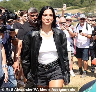 Dua Lipa arrives at Goodwood Festival of Speed in a black outfit and white T-shirt