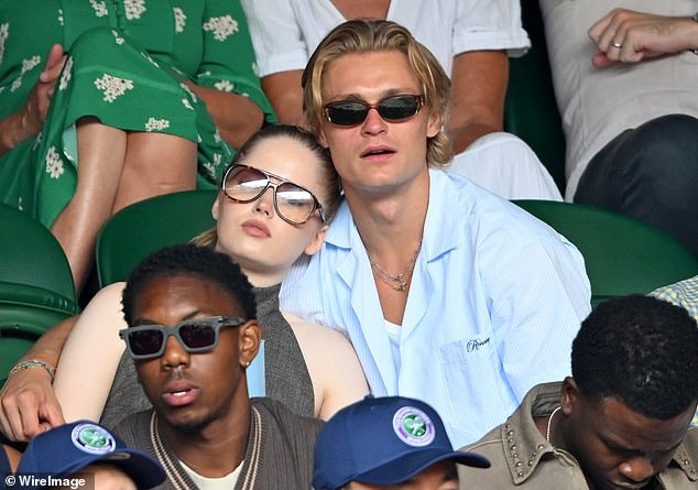 Actress Ellie Bamber's new boyfriend was revealed as handsome Danish actor and model Oliver Overgaard Reichhardt after the pair packed on the PDA at Wimbledon