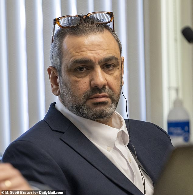 Ihsan Ali, 44, listens on Wednesday as his daughter Fatima Ali tells the court at his attempted murder trial how he tried to choke the life out of her in an alleged 'honor killing'