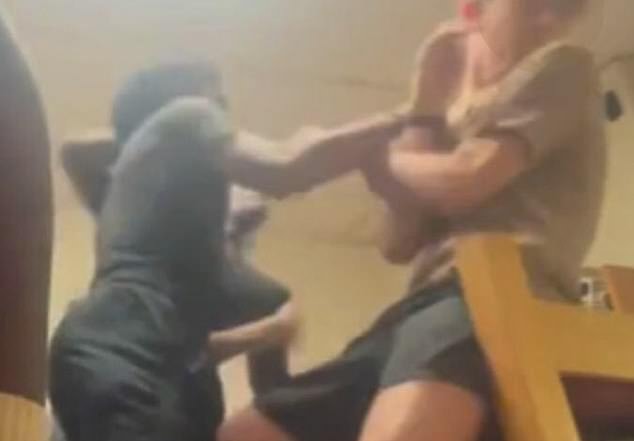 The young man was punched in the face by one individual before the group overpowered him, sending him to the floor