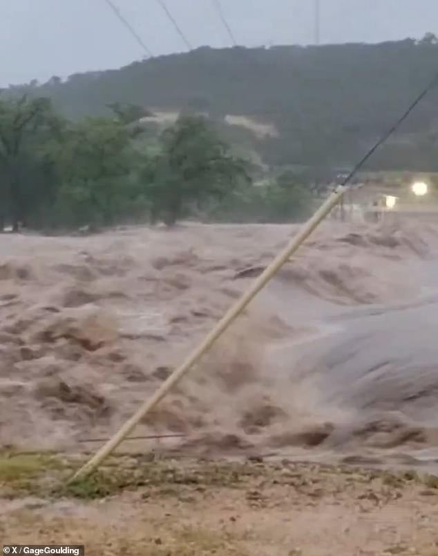 The Guadalupe River has risen to a height of 34 inches after Kerr County, Texas was pounded with more than 10 inches of rain overnight. Pictured: Flooding in Seguin, Texas this morning