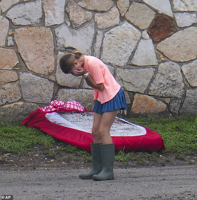Kerr County Judge Rob Kelly did not know what kind of alert system Camp Mystic had to try and get all 750 of its campers to safety (pictured: a girl reacting to the damage at the camp)