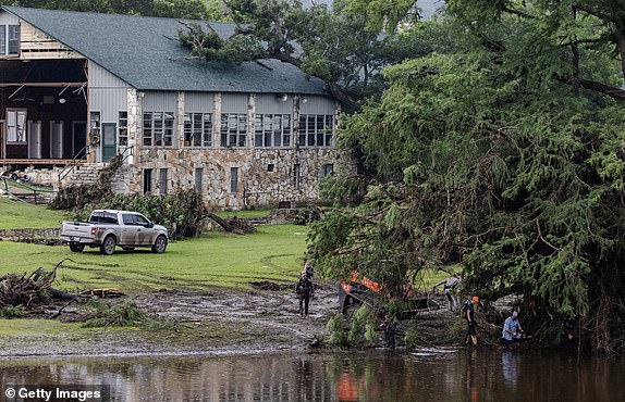 HUNT, TEXAS - JULY 6: Search and recovery workers dig through debris looking for any survivors or remains of people swept up in the flash flooding near Camp Mystic on July 6, 2025 in Hunt, Texas. Heavy rainfall caused flooding along the Guadalupe River in central Texas with multiple fatalities reported. (Photo by Jim Vondruska/Getty Images)