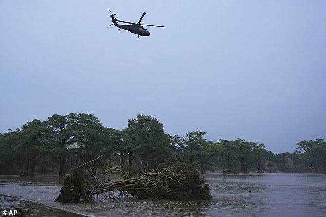 At least 24 people have been killed and scores more are feared missing after historic floods inundated Kerr County in Texas